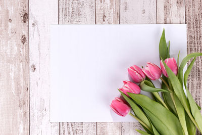 Directly above shot of pink tulips in vase on table