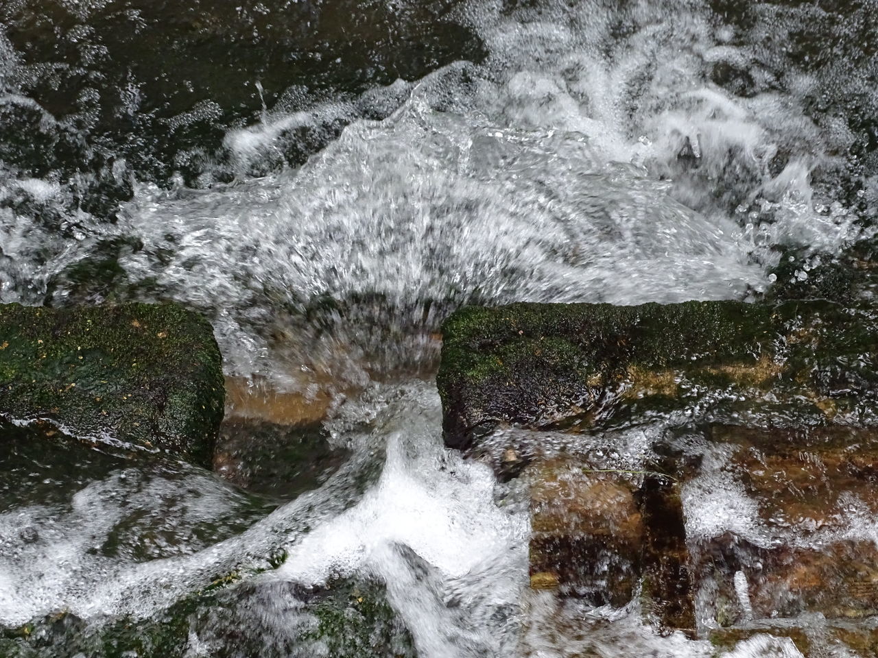 WATER SPLASHING ON ROCK