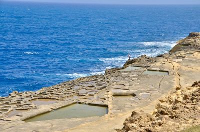 Scenic view of rocks on salt pans 