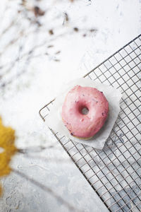 Donut on cooling rack over table