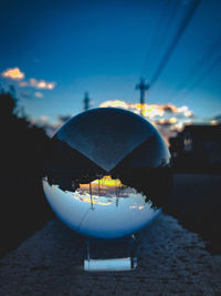 Close-up of ice cream on street in city at dusk