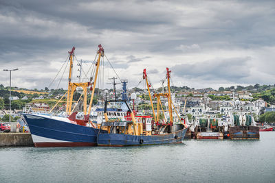 Large fishing boats moored in howth harbour, dublin, ireland