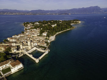 Aerial view  scaligero castle, an ancient fortress along sirmione coastal, lombardy, italy.