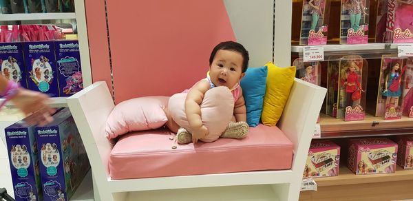 Boy with toy in store