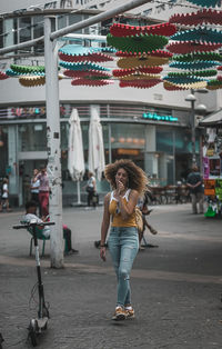 Full length of woman standing in city