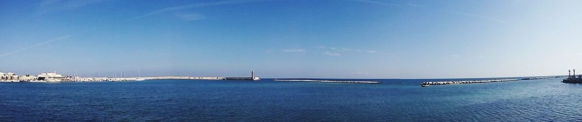 Scenic view of sea against blue sky