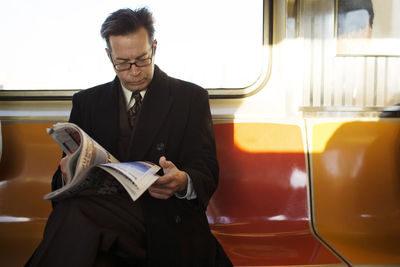 Portrait of businessman using digital tablet