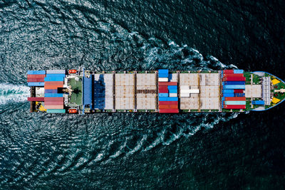 High angle view of container ship on sea shore