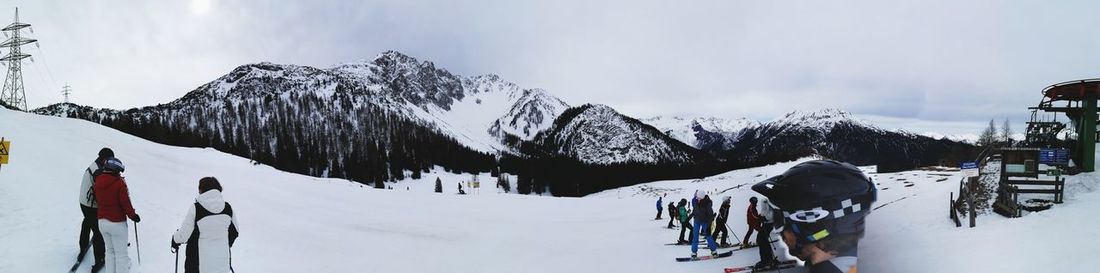 Panoramic view of snow covered landscape against sky
