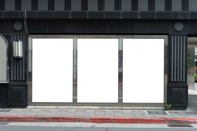 Empty street with buildings in background