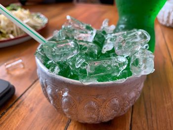 Close-up of ice in bowl on table