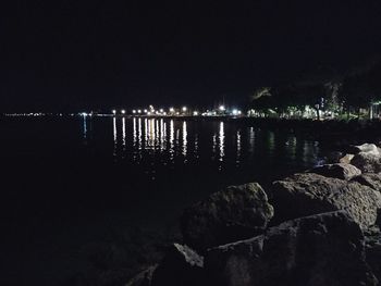 Scenic view of sea against sky at night