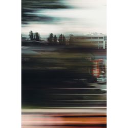 Defocused image of car against sky at night