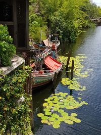 Reflection of man on boat in river