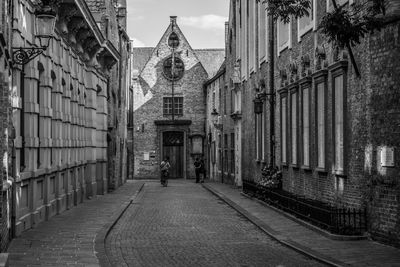 Street amidst buildings against sky