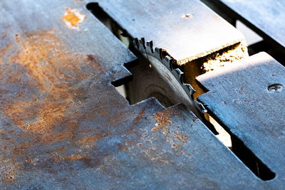 High angle view of rusty metal on table