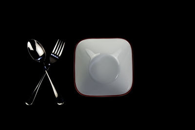 Directly above shot of electric lamp over black background