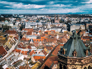 View over old houses in strasbourg with the modern european parliament in the background