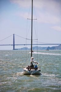 Ship sailing on sea against sky