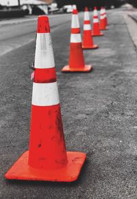 Close-up of red umbrella on road