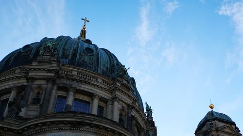 Low angle view of building against blue sky