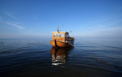 Ship in sea against sky