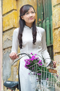 Young vietnamese girl wearing ao dai dress.