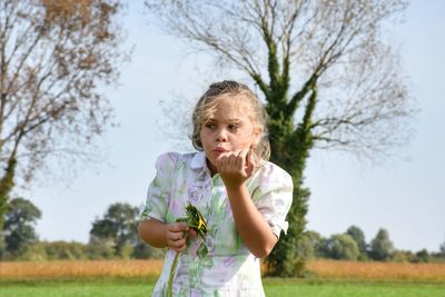 Portrait of happy girl on field