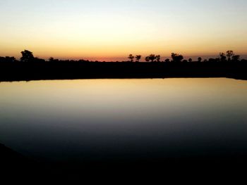 Scenic view of sunset over river