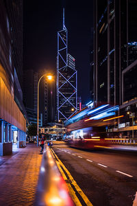 Illuminated city street at night