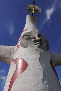 Low angle view of statue against blue sky