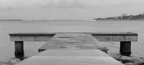 Pier on sea against sky