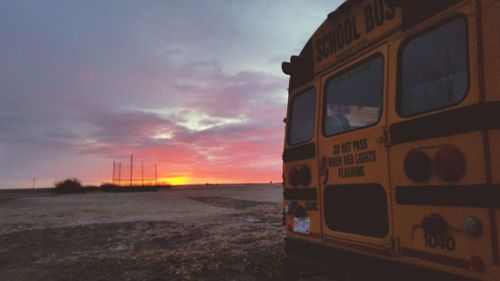 Vintage car against sky during sunset