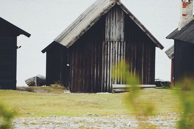 View of barn and buildings against sky