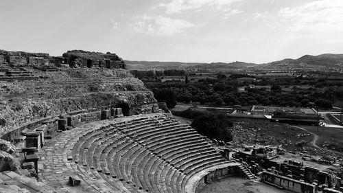 High angle view of amphitheater in city against sky