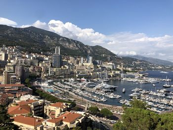 High angle view of buildings and sea against sky