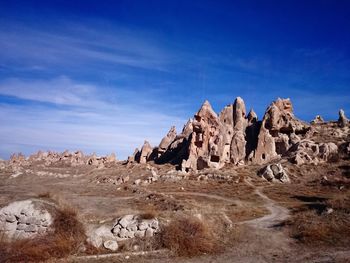 Rock formations against blue sky