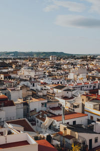 High angle view of the rooftops in seville, spain, during golden hour.