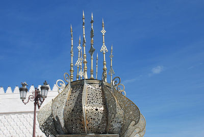 Low angle view of tower against clear blue sky