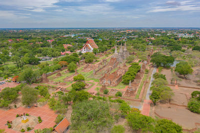 High angle view of trees and cityscape against sky