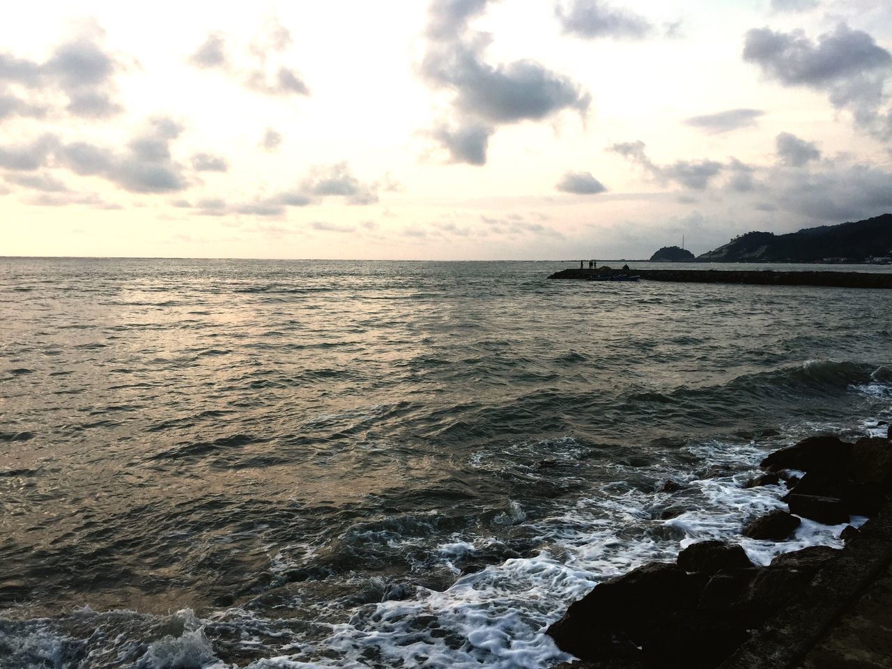 VIEW OF SEA AGAINST CLOUDY SKY