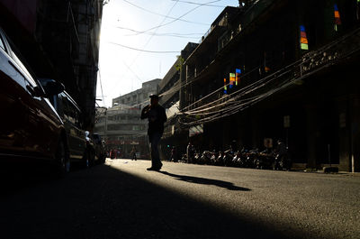 People walking on road in city