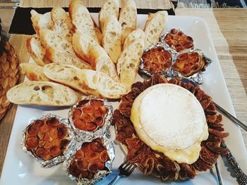 High angle view of breads in tray on table