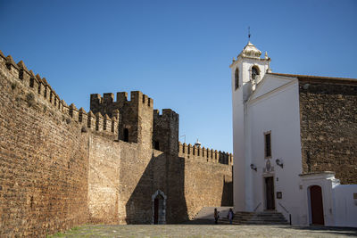 Low angle view of historic building against clear sky