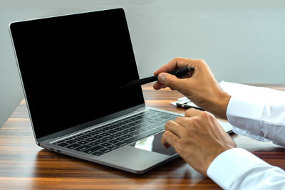 Low angle view of man using mobile phone