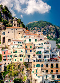 Low angle view of buildings against mountains