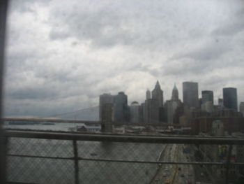 Cityscape against cloudy sky