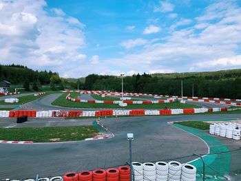 High angle view of empty race track against cloudy sky