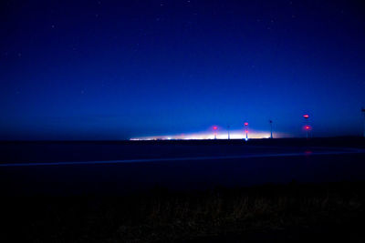 Scenic view of beach against sky at night