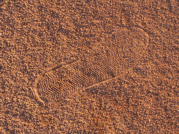 Tennis court with foot marks in antuka wait for service. empty tennis court after match.